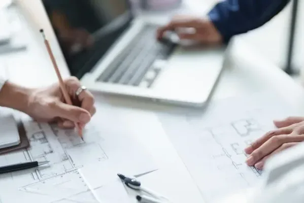 iStock-2174885196 Employees working on drafts and notes